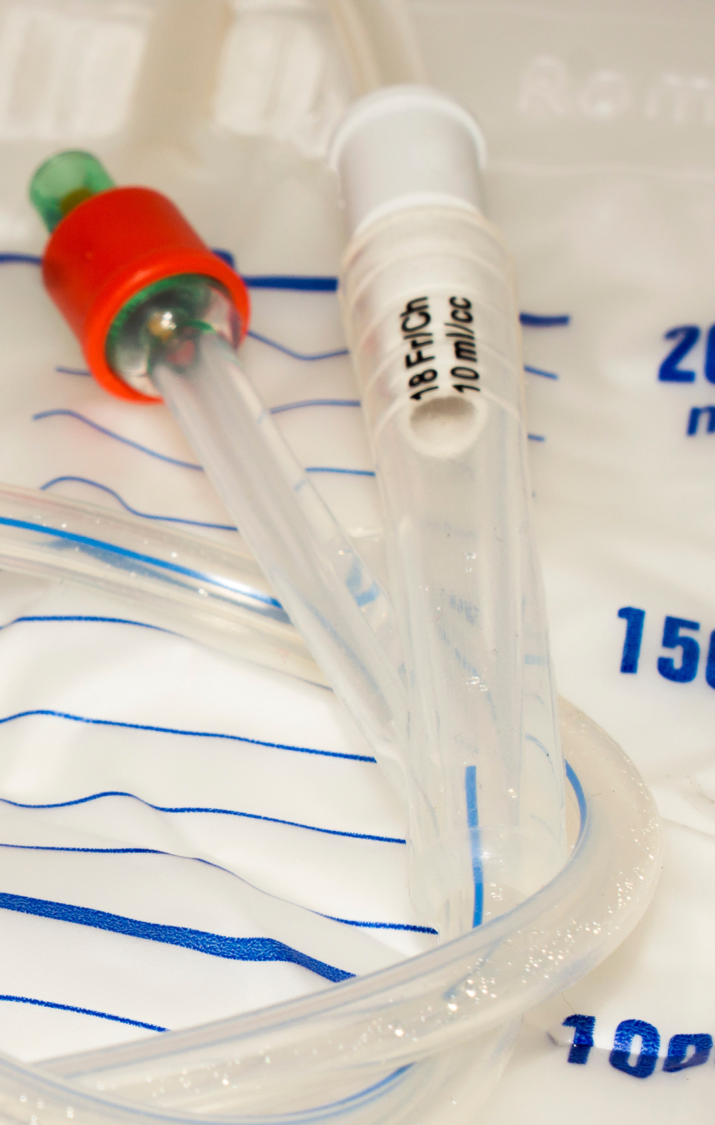 Bowel Management A representation of intestines made from pink modelling clay on a blue background.