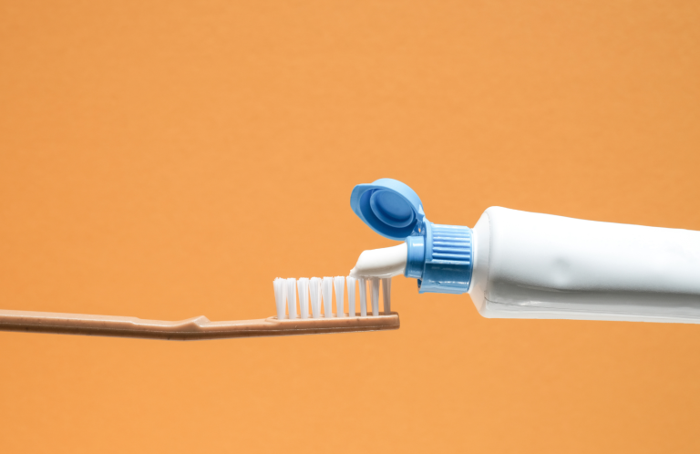 Diabetic Foot Assessment A person receiving foot care, with hands pointing to the ankle area.