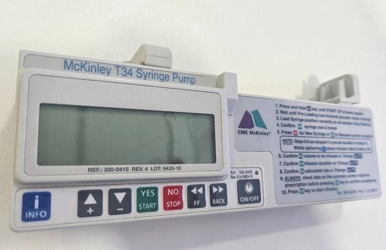 Injection practice A healthcare professional administering an injection to a training model.