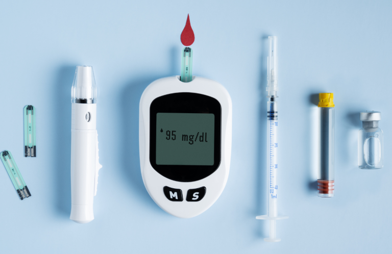 Diabetes and Insulin Administration Diabetes testing supplies including a glucose meter, test strips, and syringes on a blue background.